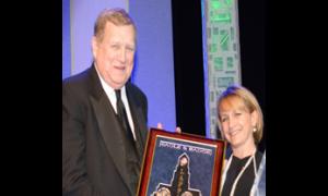 SAG-AFTRA President and actor Ken Howard accepts the “In the Line of Duty“ award from special guest presenter Gabrielle Carteris, SAG-AFTRA executive vice president.